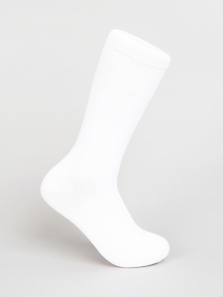 A single Solid Color Combed Cotton Sock from ID Menswear stands upright against a light gray background, showcasing its simple, classic design. In plain white, the unworn sock features a smooth texture ideal for comfortable everyday wear.
