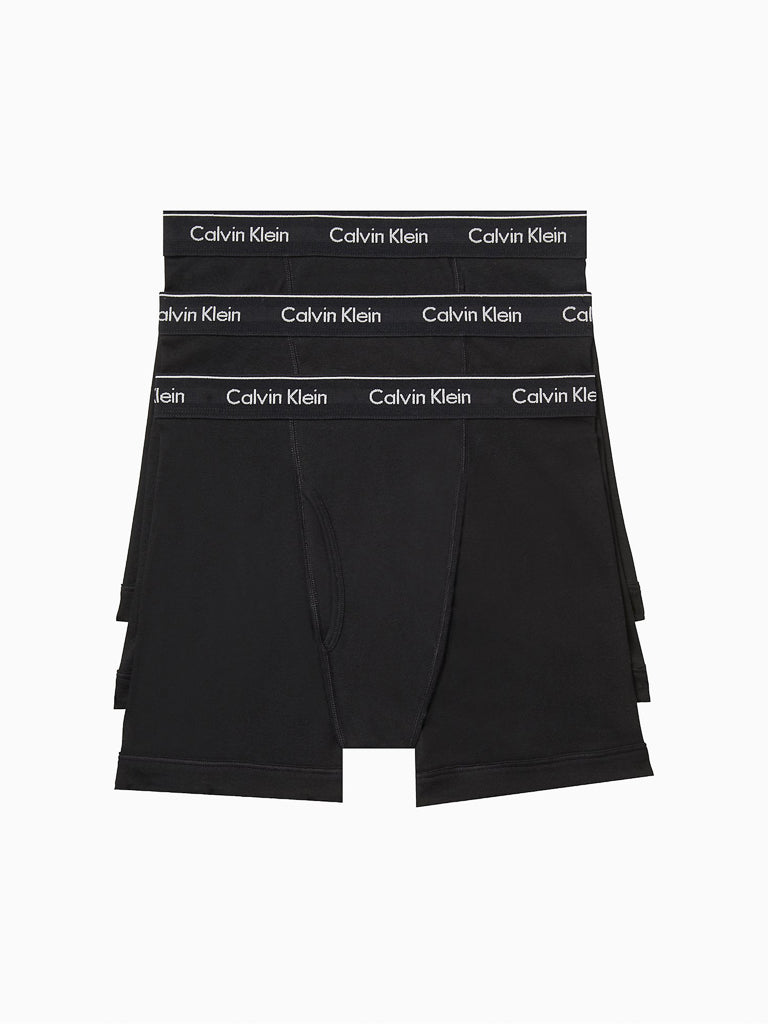 Three pairs of Calvin Klein NB4003 Cotton Classic Boxer Briefs, black, men's, with elastic waistbands featuring the Calvin Klein logo in white, crafted from pure cotton for comfort.