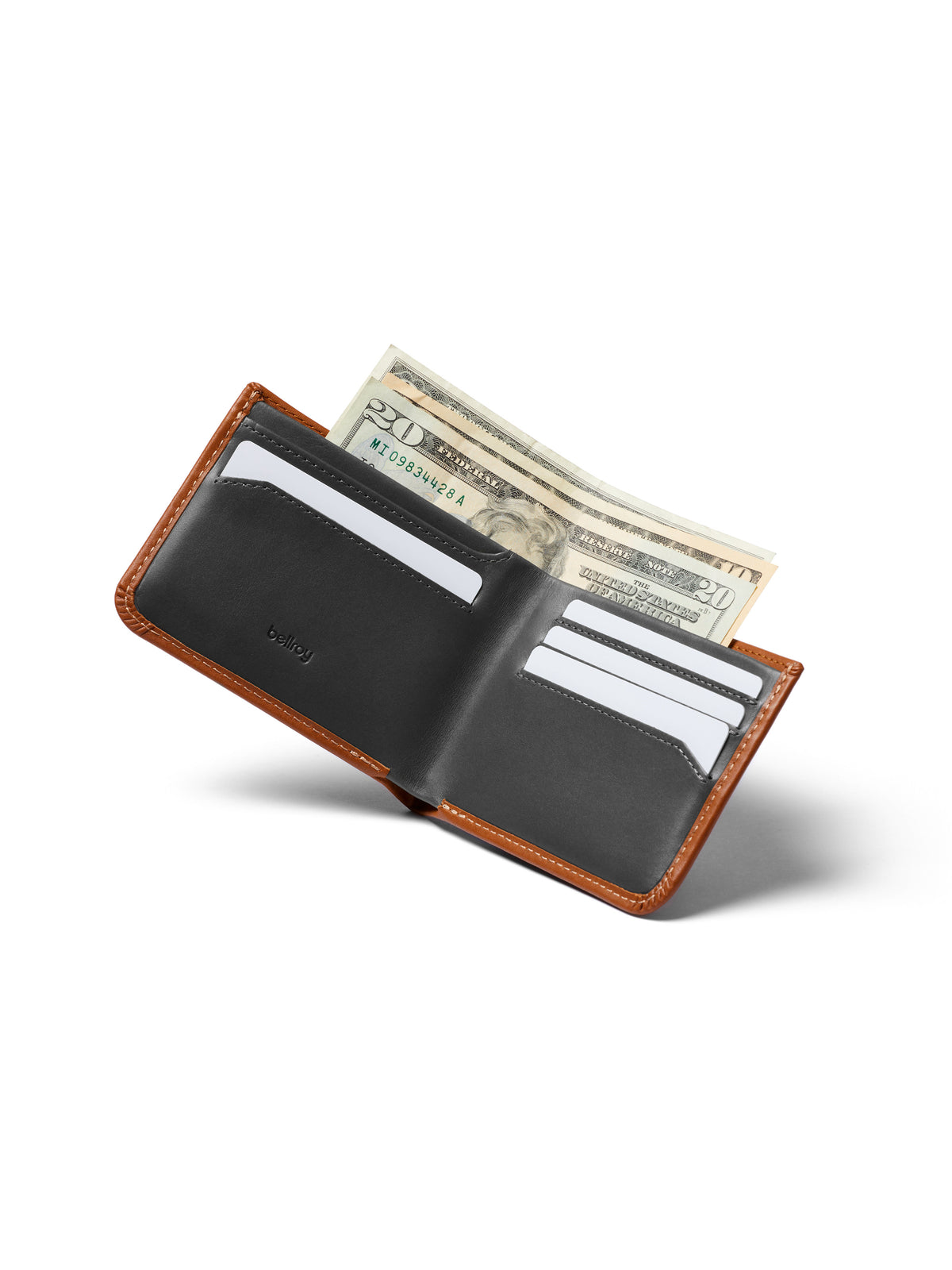 The Bellroy Hide and Seek Low Wallet, crafted from brown eco-tanned leather with a black interior, is shown open displaying multiple credit cards, two folded $20 bills, and a hidden coin pouch against a white background.