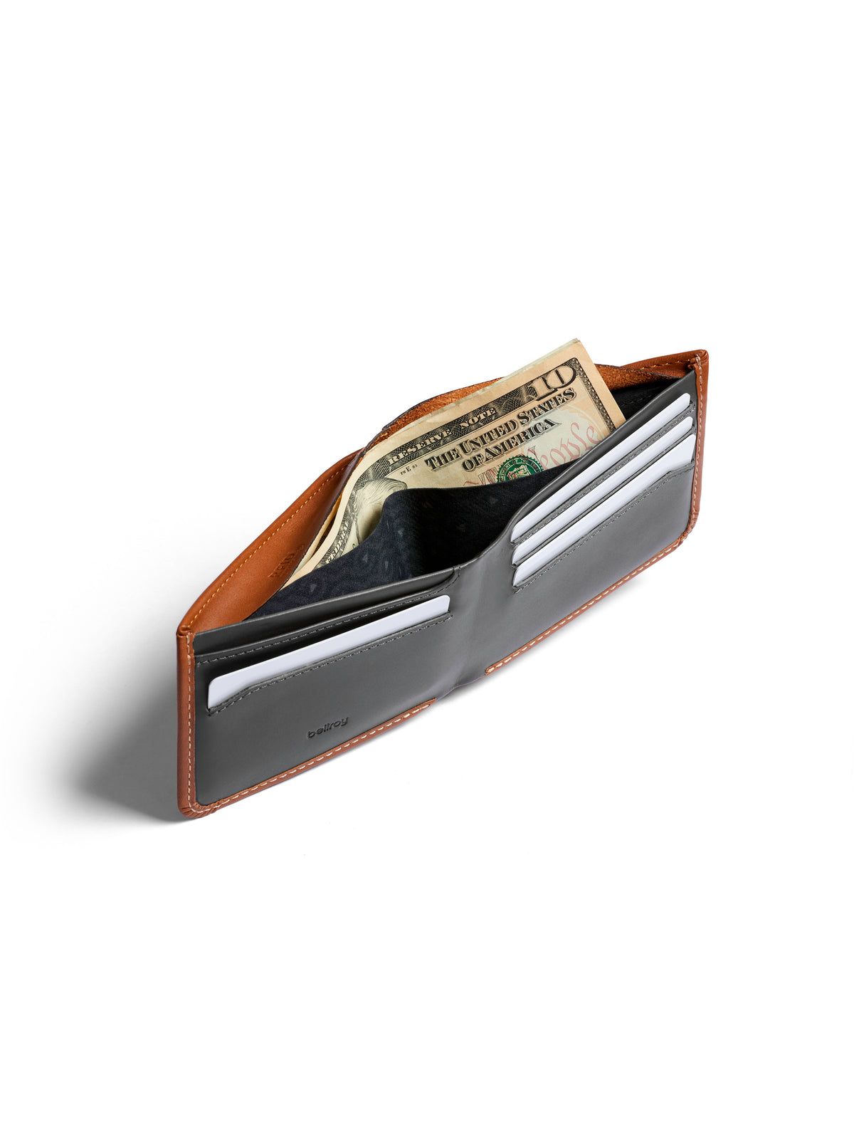 The Bellroy Hide and Seek Low Wallet, made from brown and black eco-tanned leather, is open on a white background, showing U.S. dollar bills and white cards in its slots.