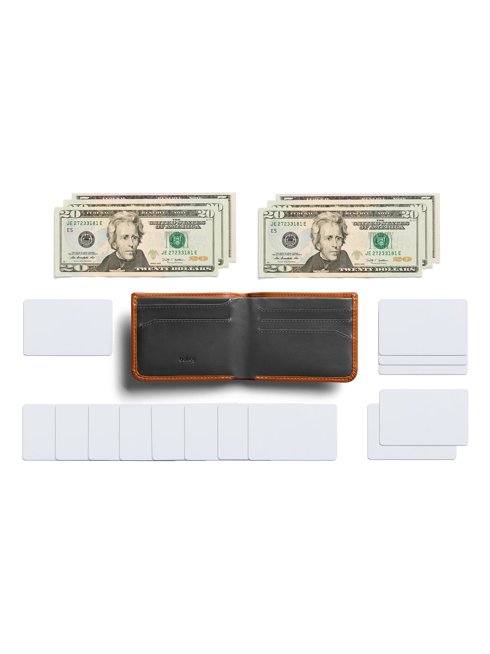 The Bellroy Hide and Seek Low Wallet, crafted from brown and black eco-tanned leather, sits open and empty between stacks of twenty-dollar bills and blank white cards on a white background.