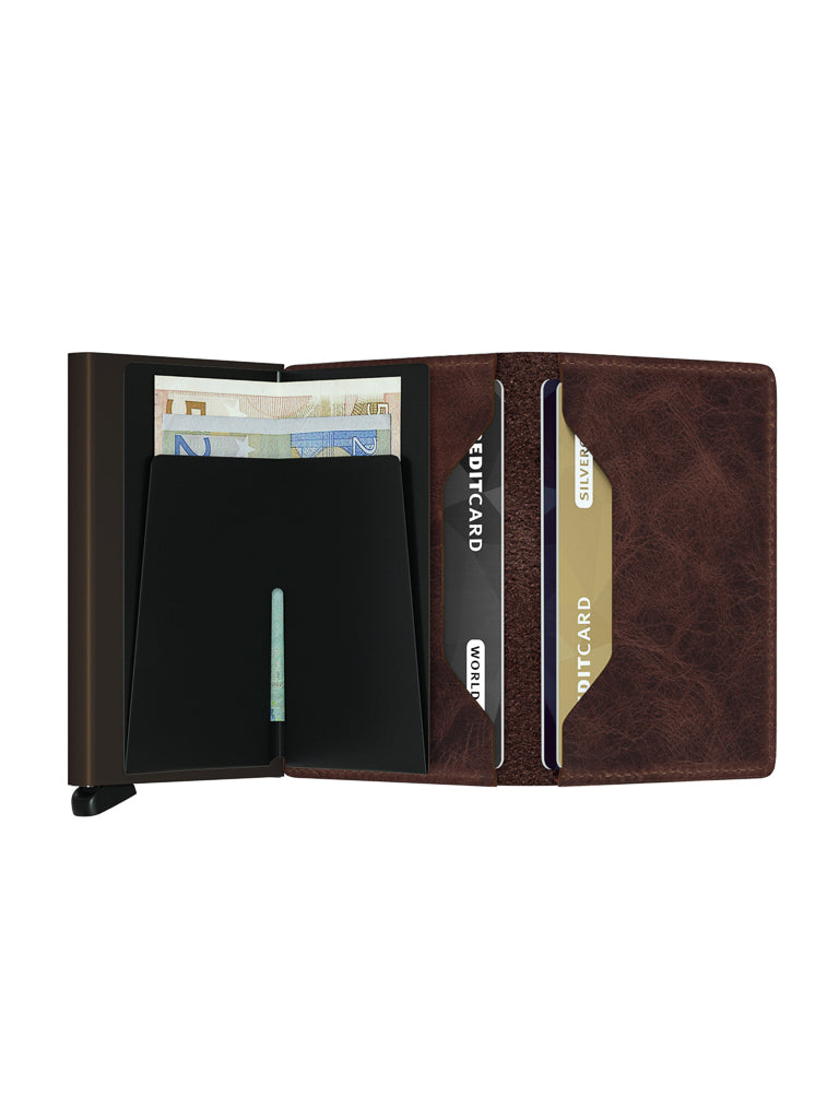 The Secrid Slimwallet Vintage Leather is an open brown wallet with card slots holding several cards, a section for folded euros, RFID protection, and a sleek black metal compartment in a modern, slim design.