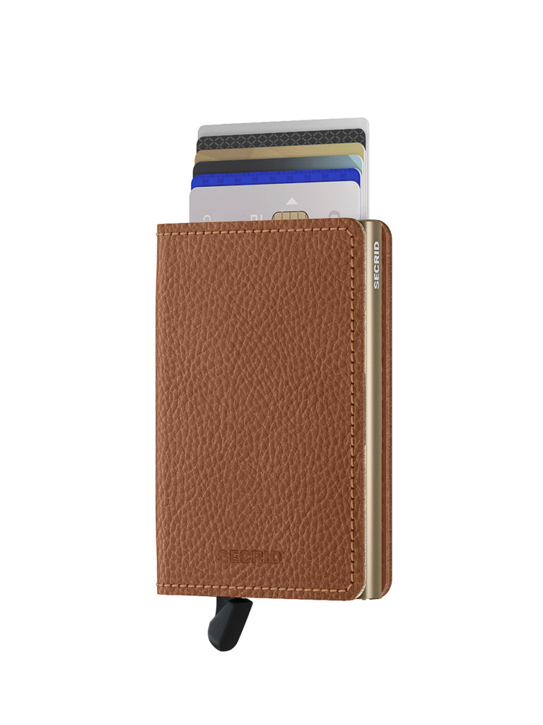 The Secrid Slimwallet Vegetable Tanned Leather is a slim, textured brown wallet with a black tab for easy card access and RFID protection, combining style and practicality with several cards partially visible at the top.