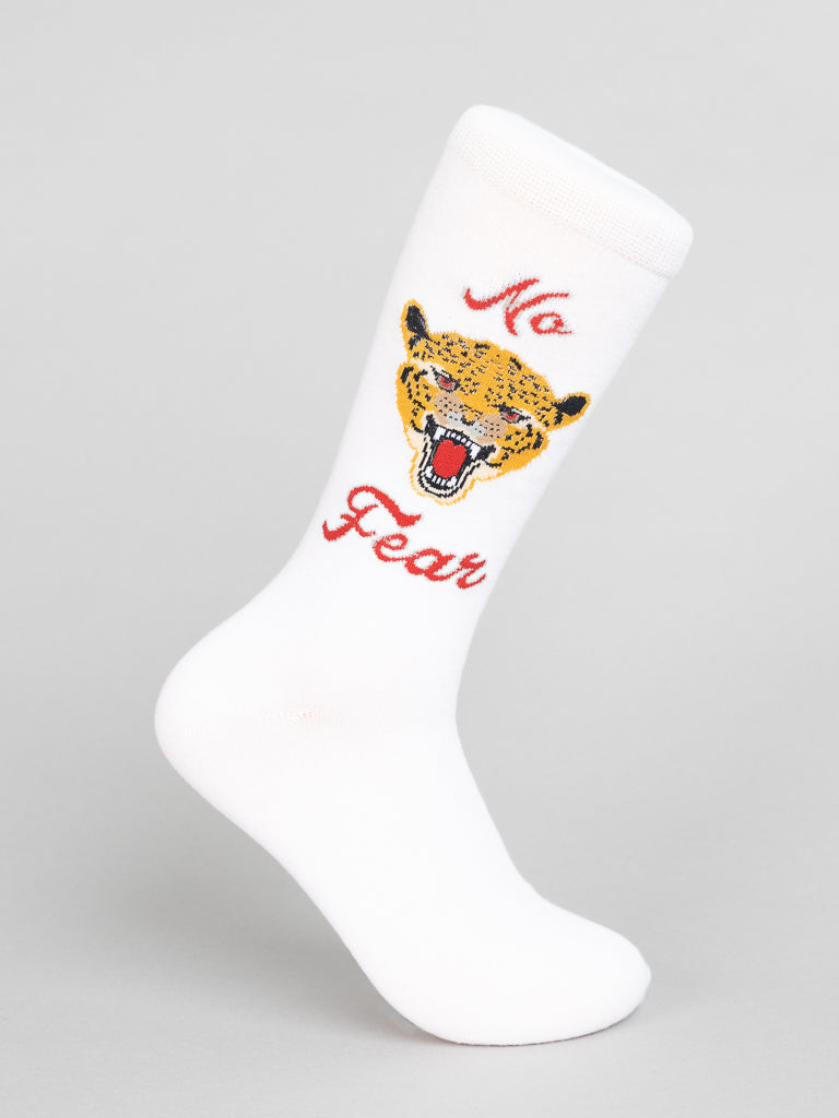 Experience unrivaled comfort with ID Menswears No Fear Graphic Socks. These white socks feature a snarling leopard print and bold red No Fear embroidery, made from high-quality combed cotton, set against a plain gray background for seamless style and substance.
