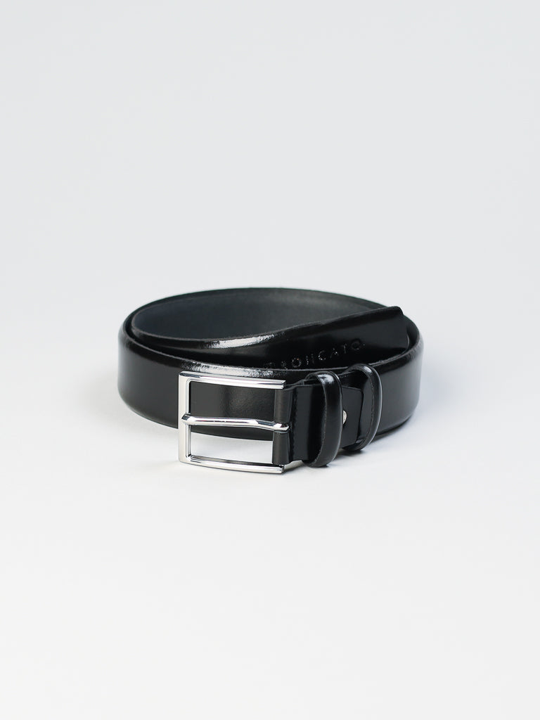 The ID Menswear 4903 Made in Italy Leather Belt, in black, features a shiny silver buckle and genuine leather craftsmanship. It is neatly coiled against a plain white background.