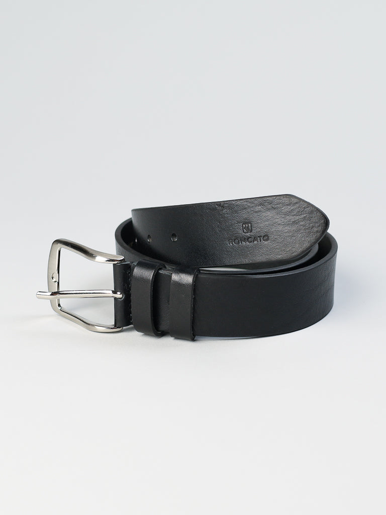 A 4550 Made in Italy Leather Belt by ID Menswear, crafted from genuine Italian leather with a shiny silver buckle and embossed logo, is shown rolled-up on a light gray background. Available in various sizes.