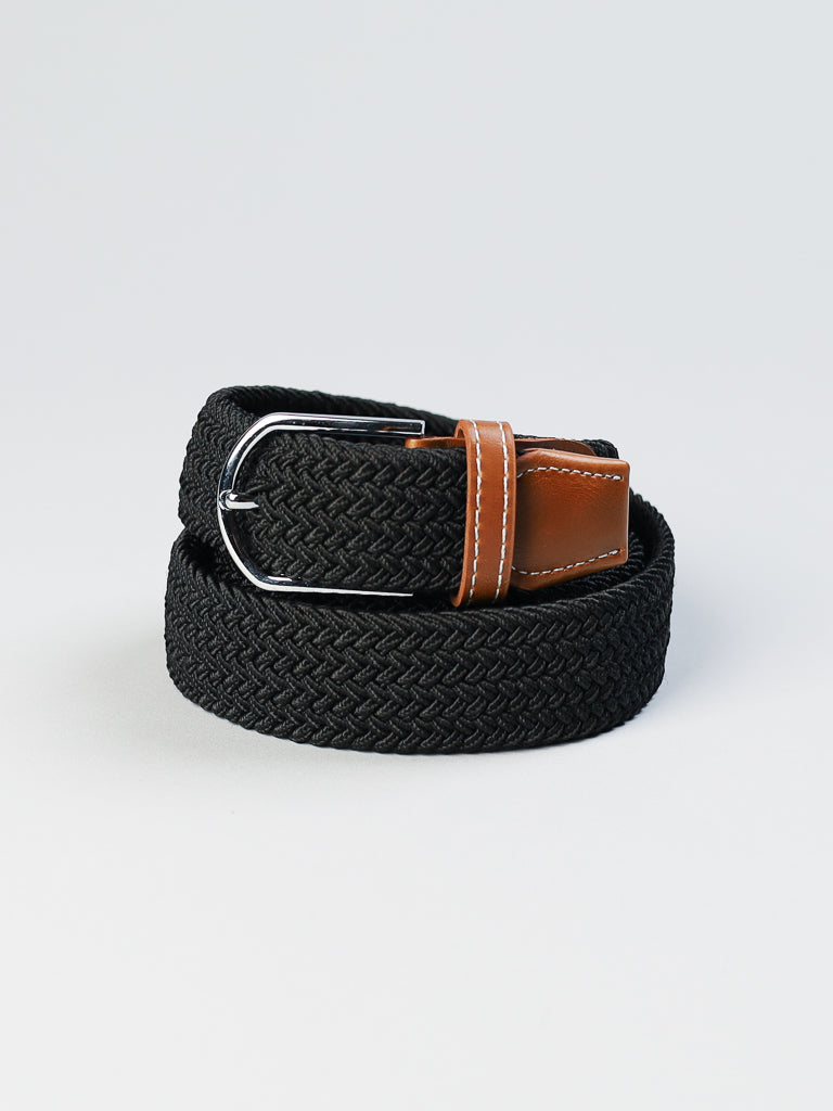 The ID Braided Stretch Woven Belt by ID Menswear, featuring a metal buckle and brown leather accents, is rolled up against a plain white background.