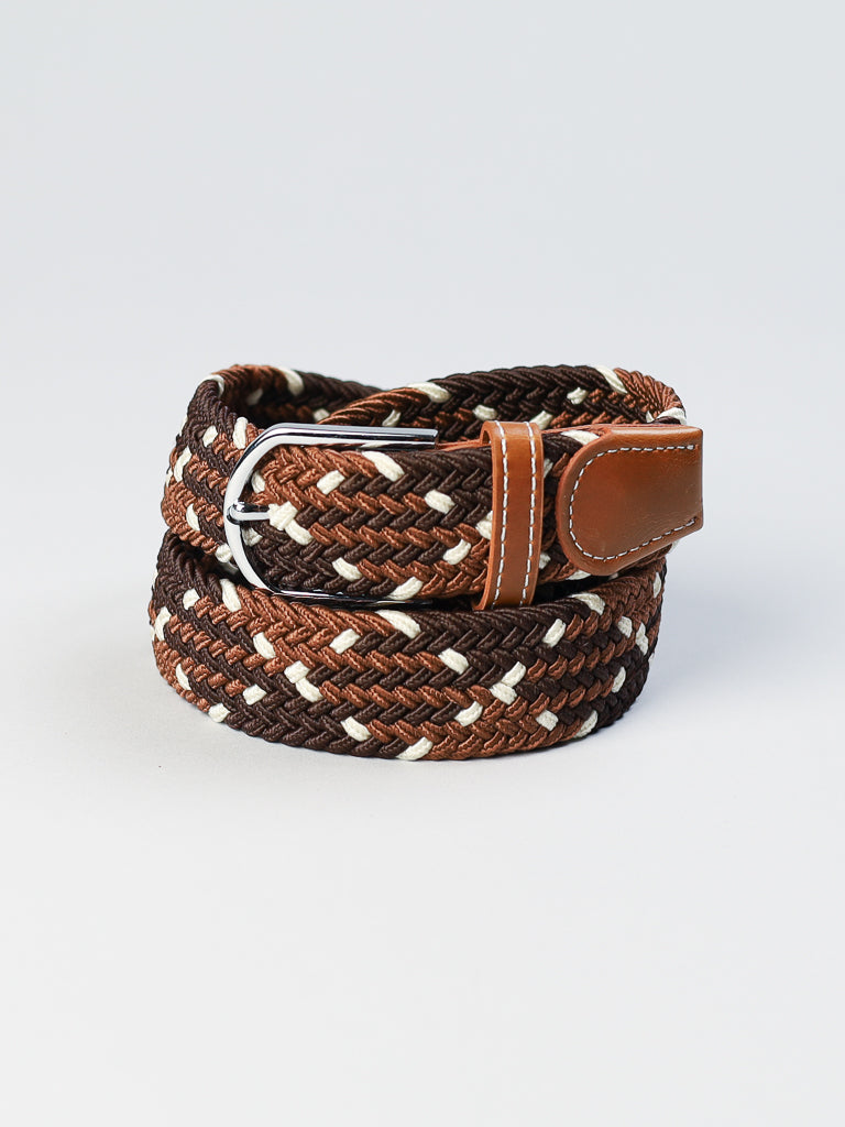 The ID Braided Stretch Woven Belt by ID Menswear in brown and beige boasts a coiled, braided texture with a leather buckle featuring intricate stitching. It elegantly contrasts against a light gray background.