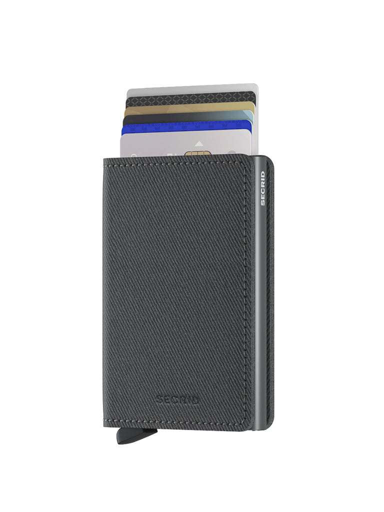 A Secrid Slimwallet Twist Twill Leather in black stands upright, partially open to reveal several cards. This slim leather wallet provides RFID protection, keeping your essentials secure against a white background.