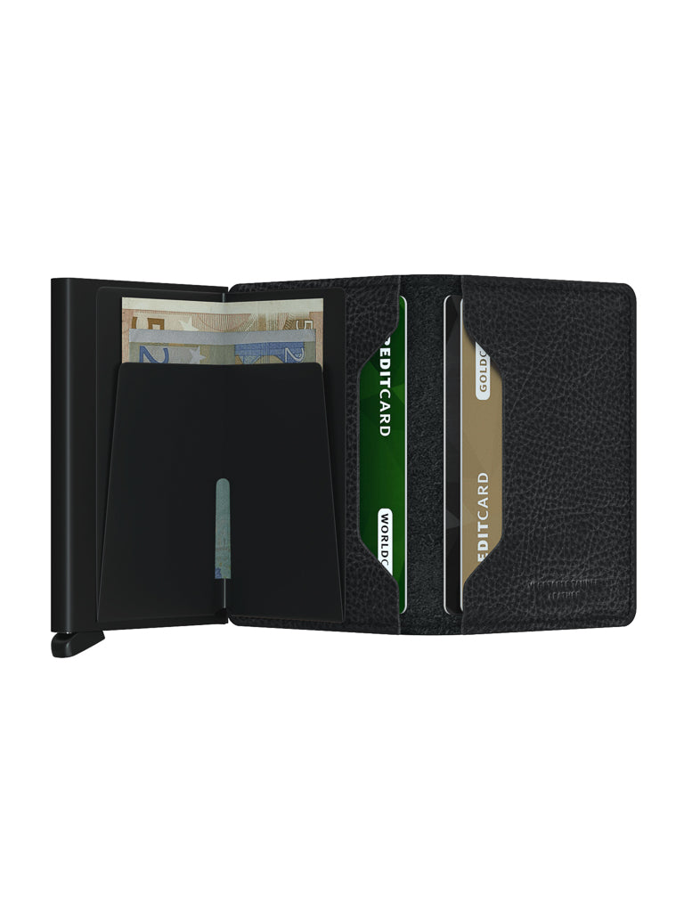 The Secrid Slimwallet Vegetable Tanned Leather is a slim black wallet with RFID protection, featuring a sleek design, slots for bills and three cards, and crafted from vegetable-tanned leather.