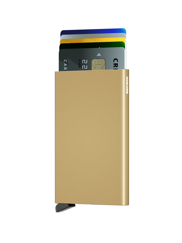 The Secrid Cardprotector Minimal Wallet in gold secures your cards with RFID protection. A black lever at the bottom allows several cards—gray, blue, and yellow—to partially extend for easy access.