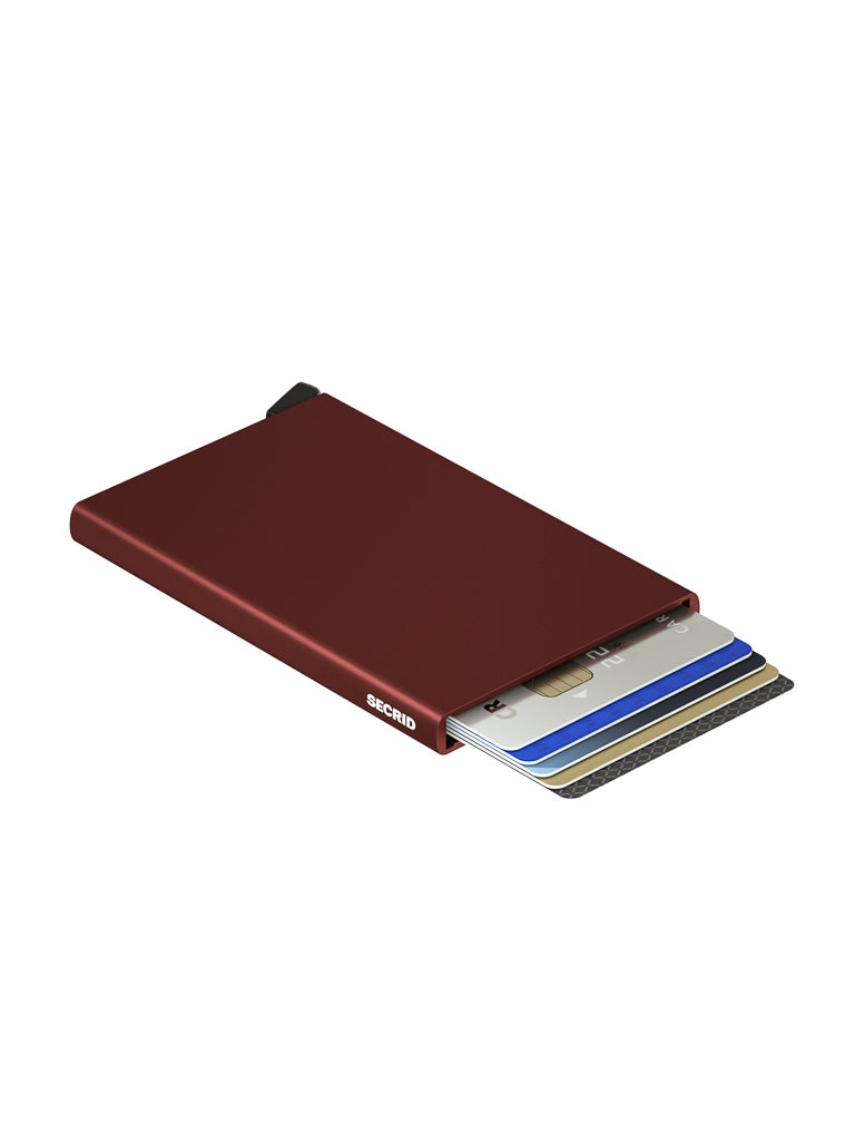 The Secrid Cardprotector Minimal Wallet is a slim, burgundy RFID-safe cardholder with the Secrid logo, designed to securely hold and partially extend several credit cards in a fanned display.