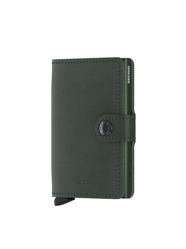 The Secrid Miniwallet Original is a dark green leather wallet with RFID protection, snap button closure, and SECRID branding on the front. Compact and minimalist, it offers modern convenience in a sleek design.