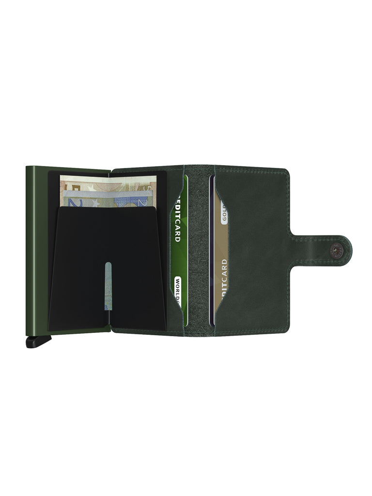 The Secrid Miniwallet Original by Secrid is a dark green compact wallet with multiple compartments, holding euro notes and three cards. It features RFID security, a snap closure, and is displayed on a white background.