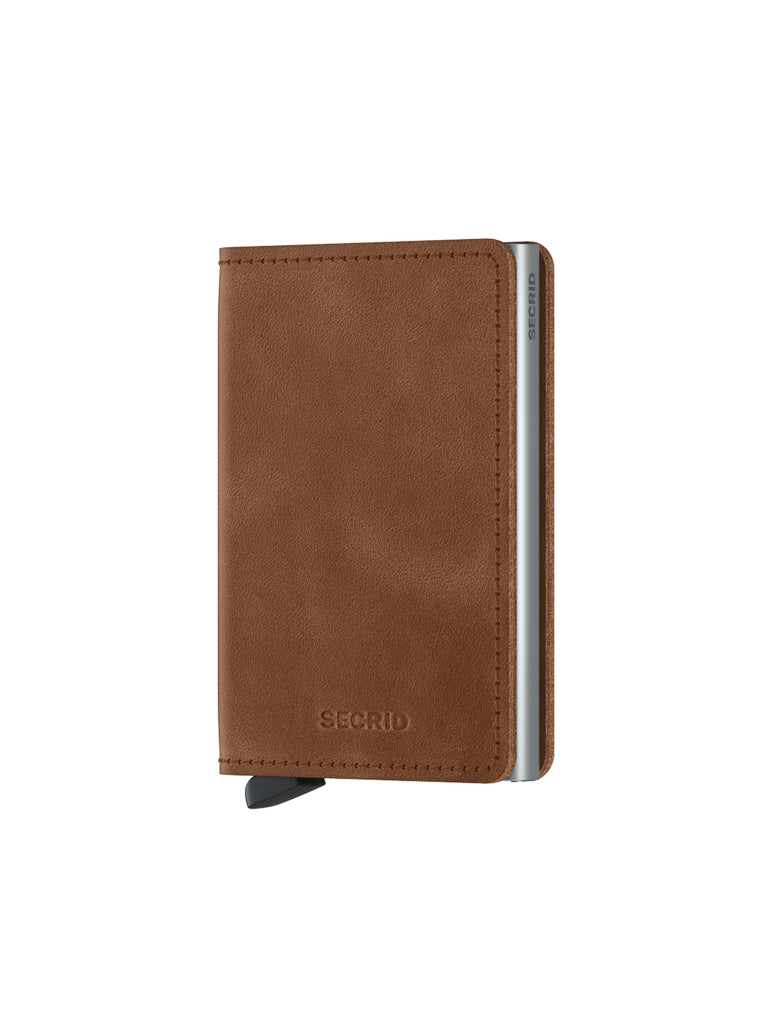 The Secrid Slimwallet Vintage Leather is a brown wallet with RFID protection, shown angled with a small black tab at the bottom. The SECRID logo is embossed on the front.
