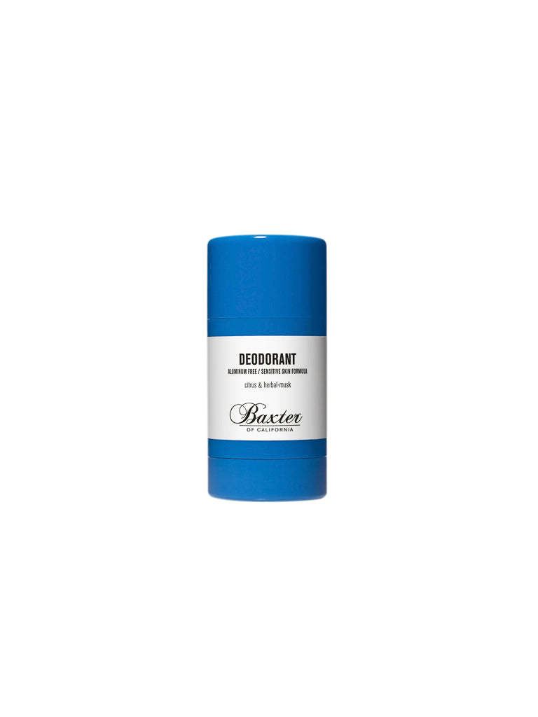 A blue stick of Baxter Aluminium and Alcohol-Free Natural Deodorant stands upright on a white background. Its white label highlights that it's suitable for sensitive skin and features a citrus and herbal musk scent.