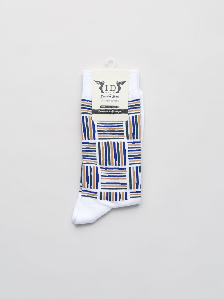 The Spongee Graphic Socks by ID Menswear showcase a striking pattern of blue, black, and tan stripes on premium combed cotton. The design offers unmatched comfort on a light background with a product information label attached at the top.