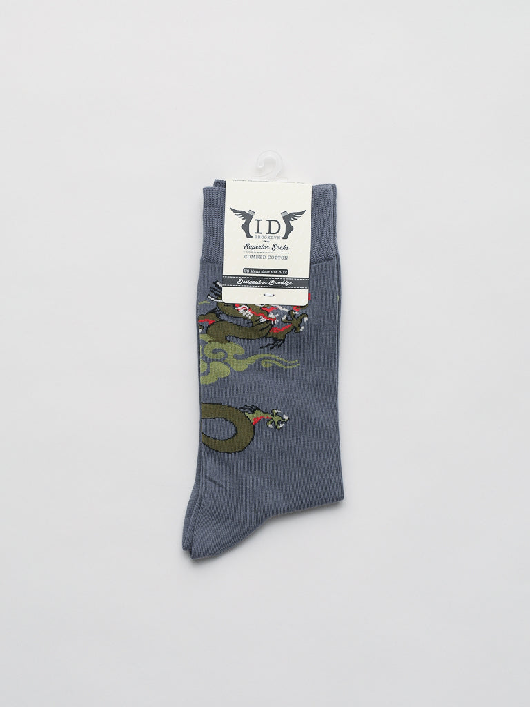 ID Menswears Dragon Graphic Socks are gray, made from premium combed cotton for comfort, and feature a bold red and green dragon design with a white ID tag.
