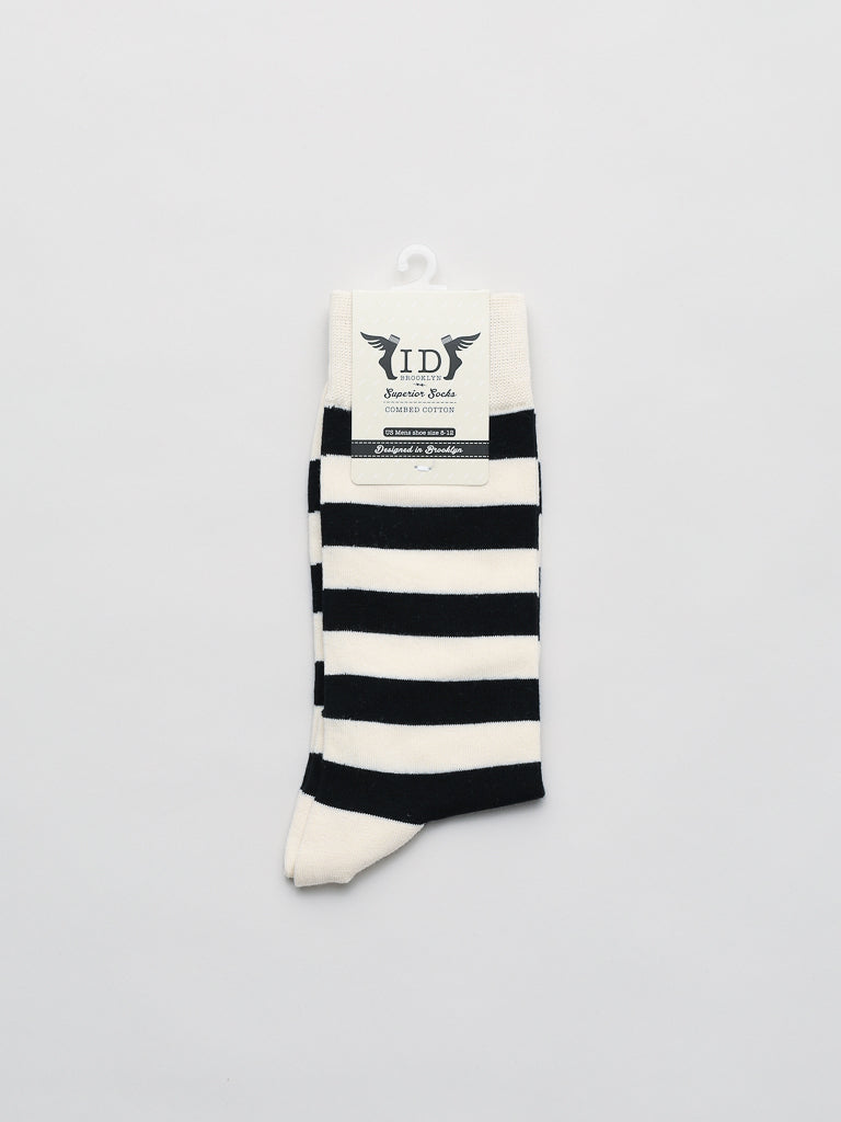 The Stripe Graphic Socks by ID Menswear, a versatile black and white horizontally striped accessory, are displayed with a label attached at the top against a plain white background.