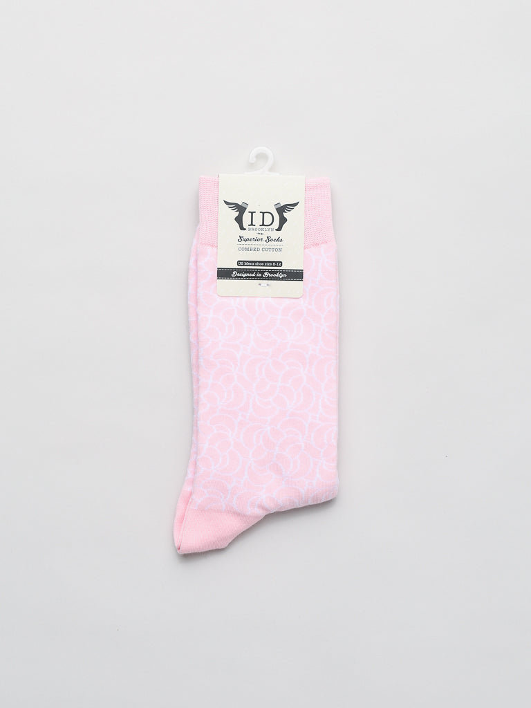 Ellipsis Graphic Socks by ID Menswear feature a subtle floral design crafted from breathable bamboo fabric. Neatly folded, they attach to the black and white ID Bambu Socks label, stating Classic Comfort and Bamboo & Amicor, resting stylishly on a light gray background.