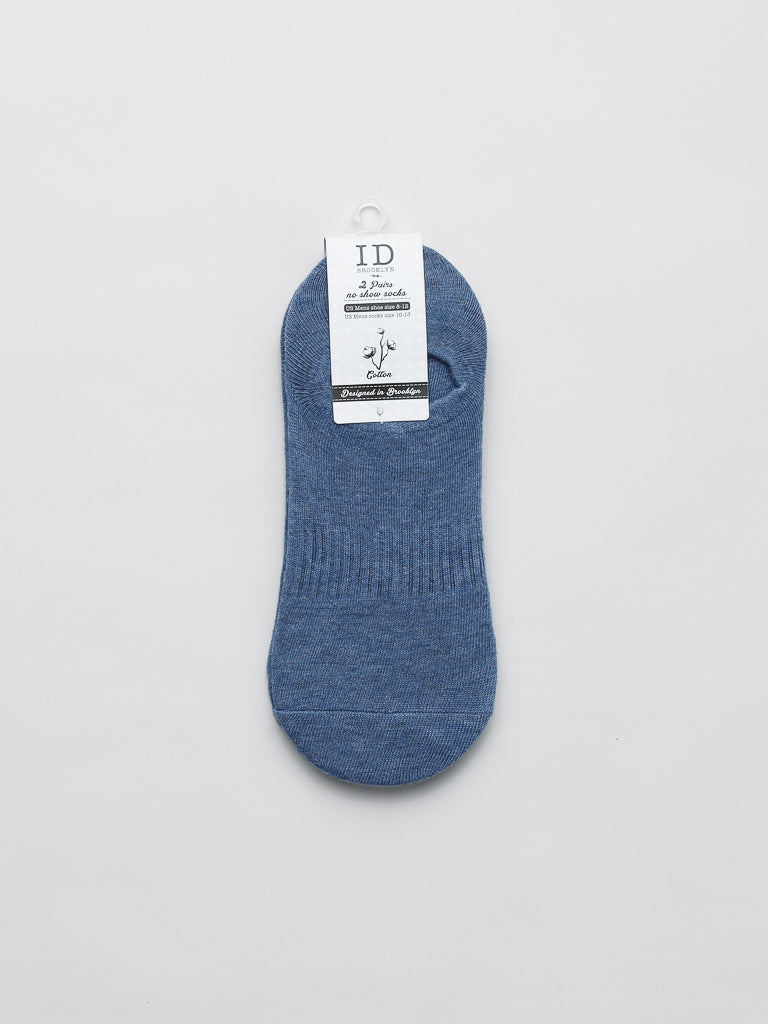 A blue No Show Ribbed Sock by ID Menswear is crafted from combed cotton with a white label featuring text and logo against a plain white background. The ribbed midsection ensures a snug fit, and the breathable fabric offers added comfort.