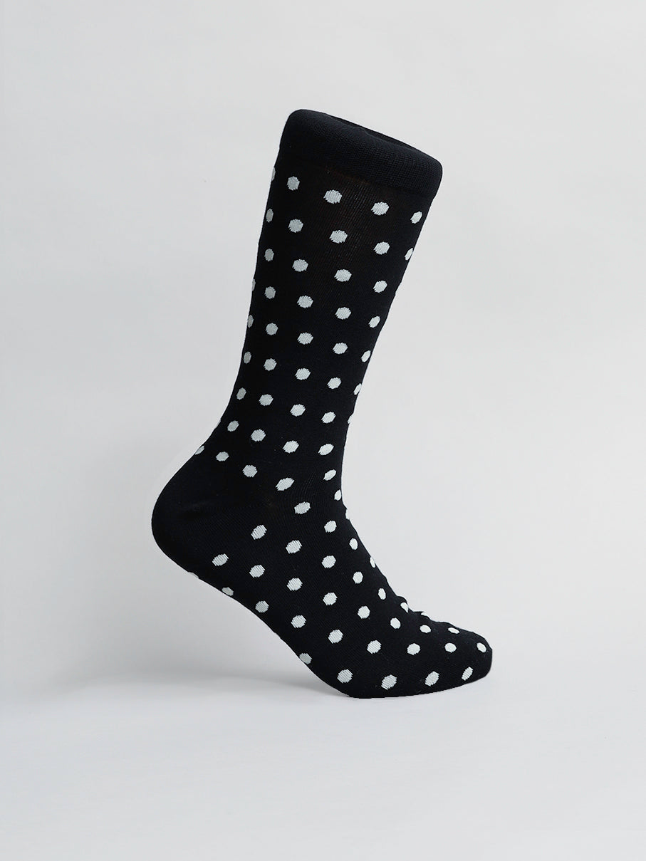 The Polka Dot Graphic Sock from ID Menswear is shown standing against a white background, crafted from premium combed cotton in black with its distinctive and comfortable design.