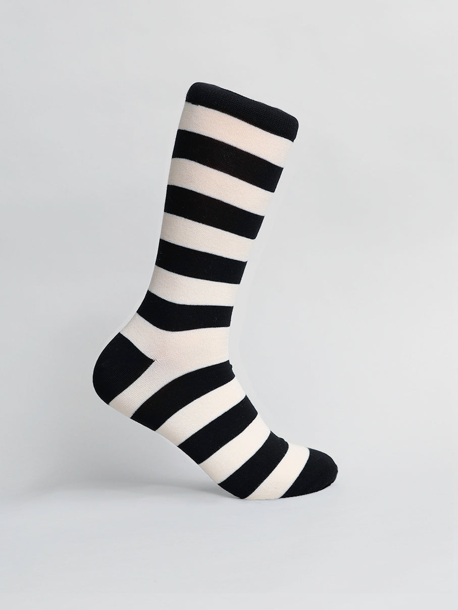 The Stripe Graphic Socks by ID Menswear are displayed on a neutral background, featuring bold black and white horizontal stripes in a classic pattern. This versatile accessory is highlighted beautifully against the simple backdrop.