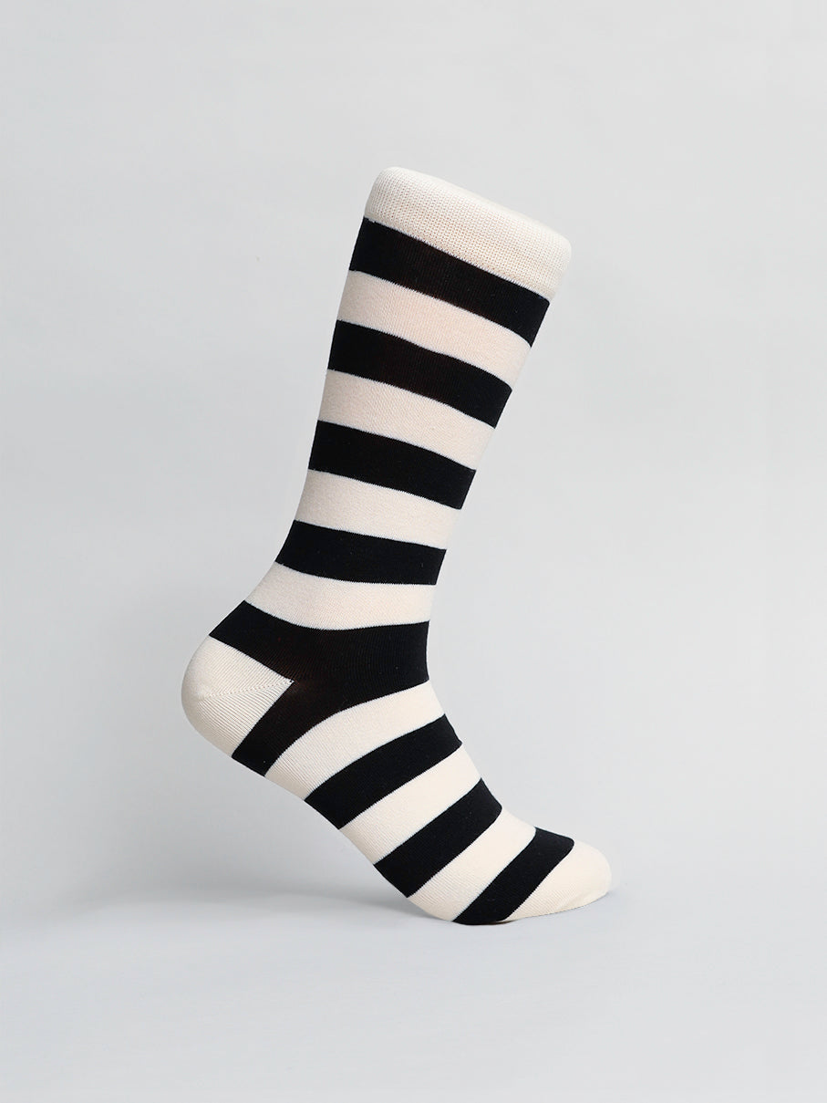 The ID Menswear Stripe Graphic Socks, a versatile white sock with black stripes, is showcased against a plain background with the toe pointing down and heel visible.