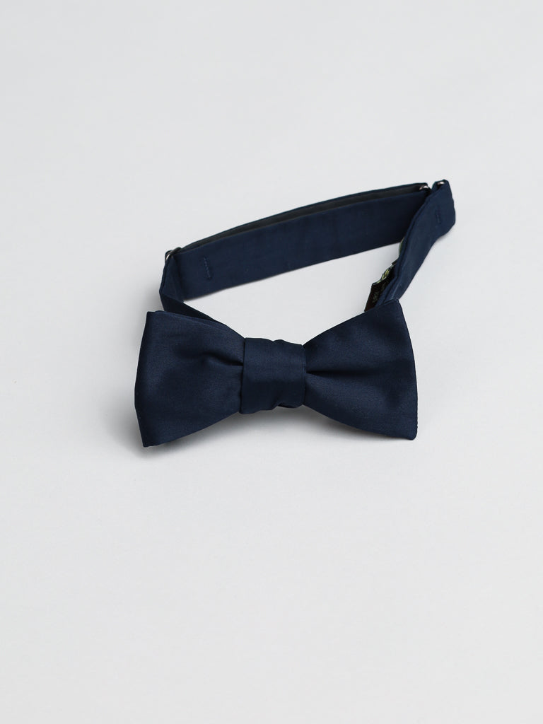 The Midnight Cotton Bow Tie by ID Menswear features an adjustable strap and is handmade in Brooklyn. Shown here on a plain white background.