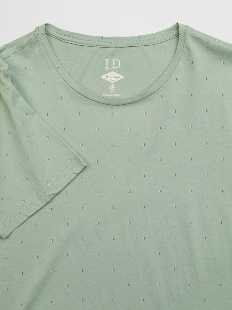The Heritage Printed Organic Cotton Tee by ID Menswear is a light green shirt with a small dotted pattern and logo text near the collar, offering a classic fit.