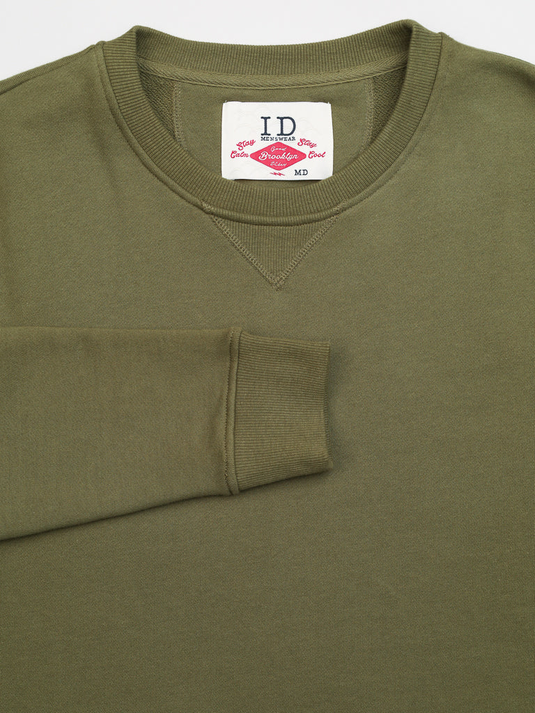 The olive green Everyday French Cotton Terry Crewneck Sweatshirt by ID Menswear features a visible red ID tag inside the collar. Crafted from French cotton terry, this neatly designed garment has long sleeves and a simple, clean look.