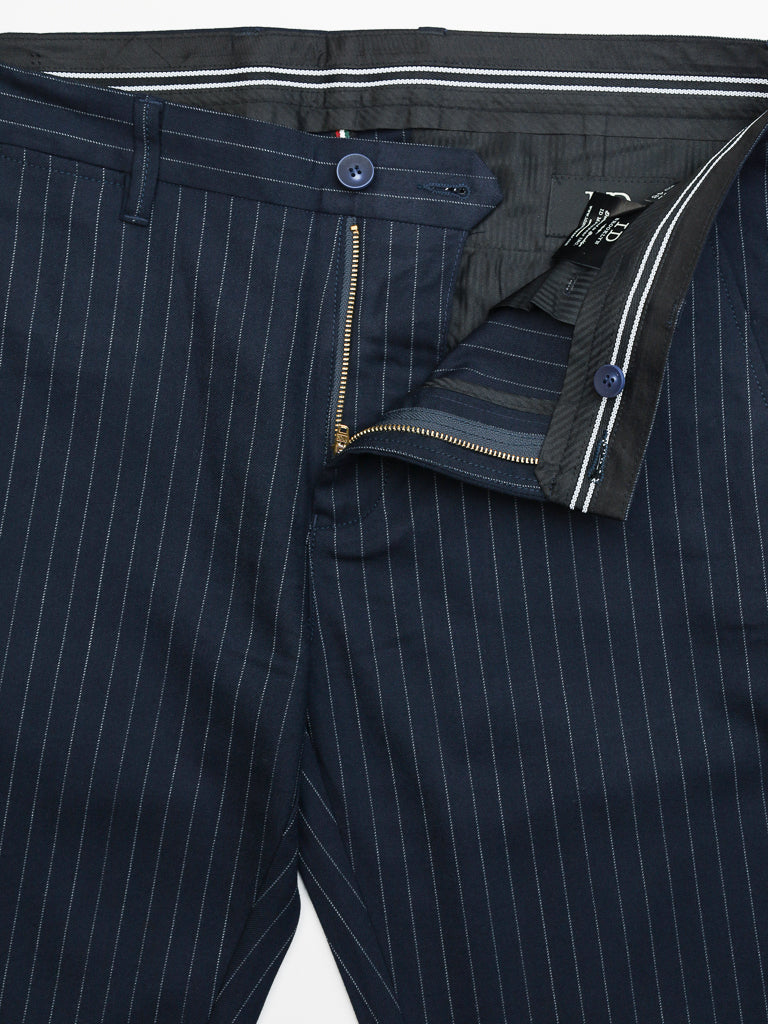 Close-up of ID Menswears Hudson Wool Blend Pin Stripe Pant, featuring a premium wool blend with vertical white pinstripes, visible waistband lining, belt loops, button closure above an open zipper, and partially open pocket.