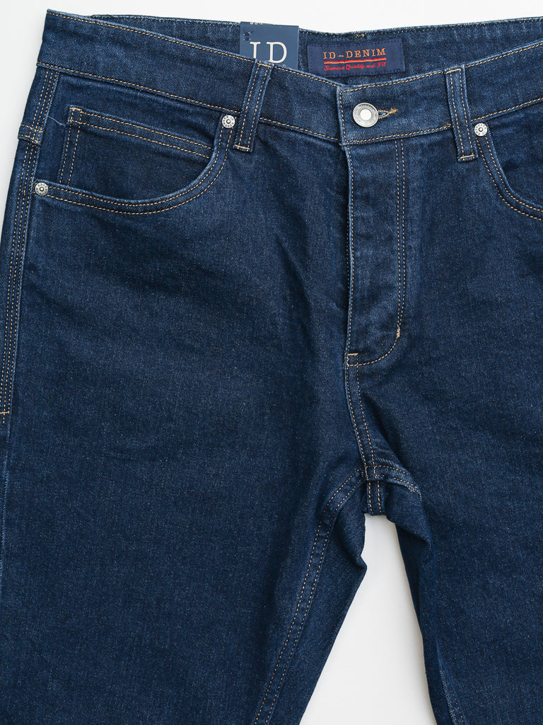 Close-up of the Ganbaru Stretch Jean by ID Menswear reveals front pockets with metal rivets, button, and zipper. This slim-tapered design features visible stitching, a partially visible label on the waistband, and premium cotton twill fabric.